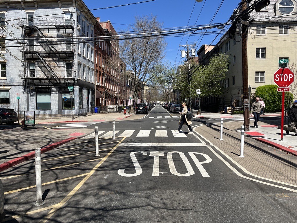 Paint and flexible posts extend the curb beside a crosswalk at Second and Bloomfield in Hoboken.